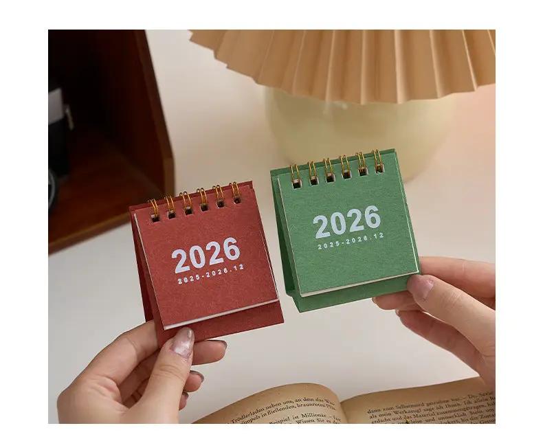 Mini desk calendar set of 2 in red and green with coil binding by Simples Market.