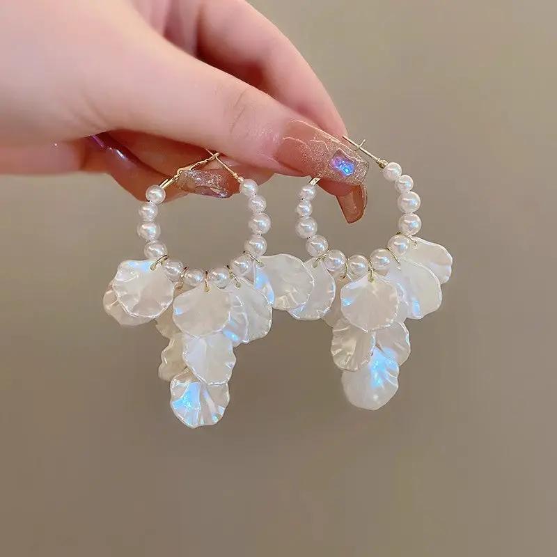 White pearl hoop earrings by Simples Market with glossy shell flower petals (pair)