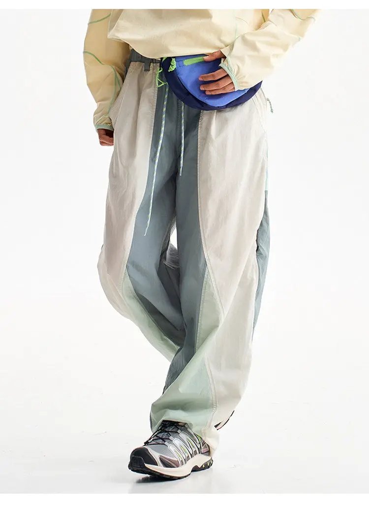 Men's outdoor quick-dry cargo pants by Simples Market with color-block panels and blue waist bag