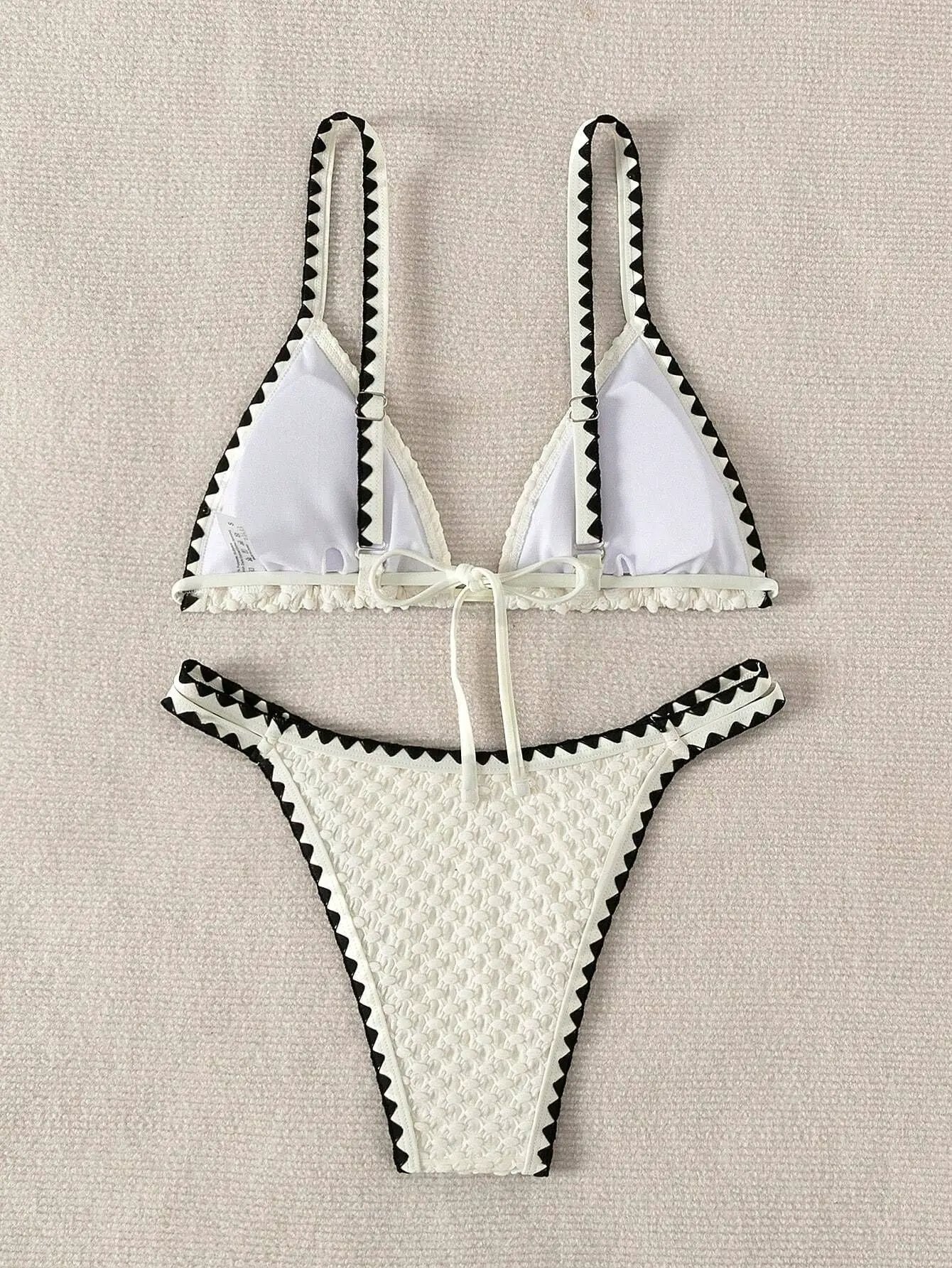 White two-piece bikini with black zigzag trim and tie-front detail by Simples Market
