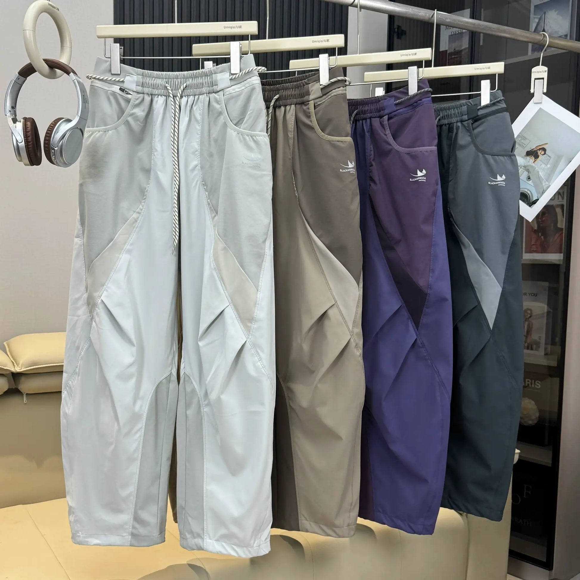 Casual cargo track pants in light gray, beige, taupe, purple and slate with BLACKARMADA branding.