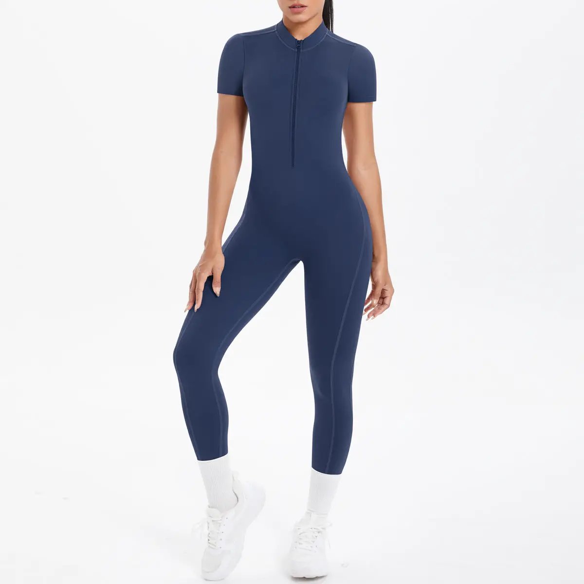Simples Market navy blue bodycon jumpsuit with short sleeves and front zip on model