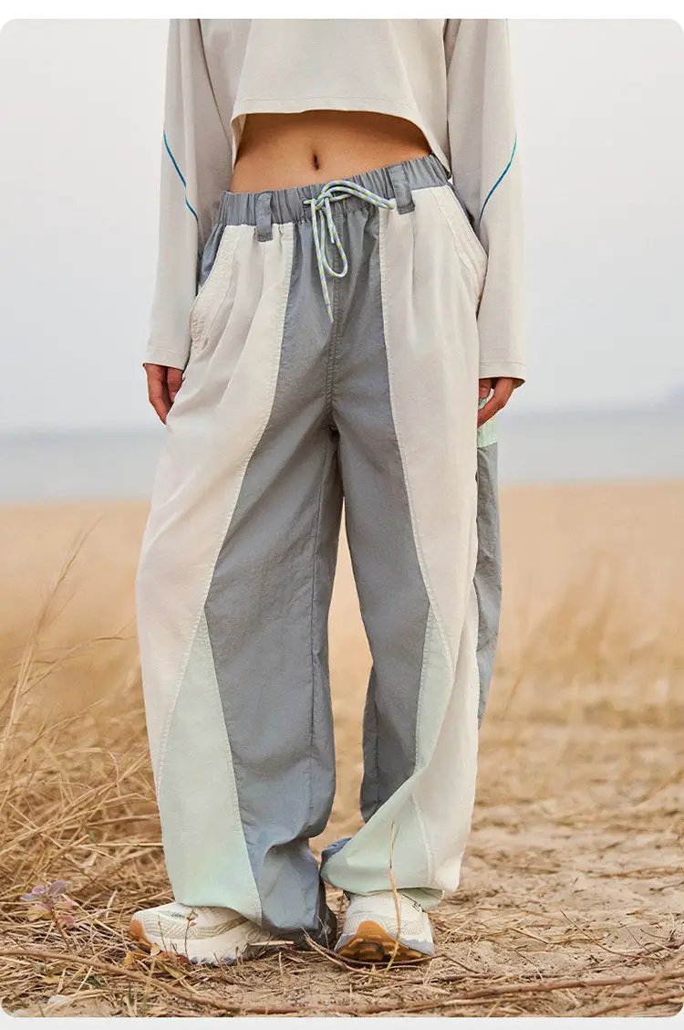 Wide-leg color-block cargo pants with gray and beige panels, drawstring waist, quick-dry fabric