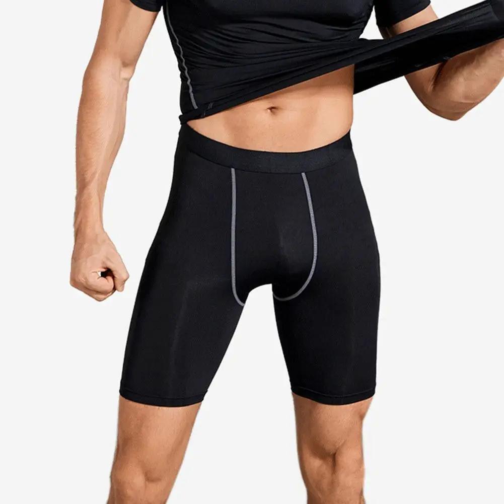 Men's compression shorts with pocket by Simples Market, black quick-dry stretchy base layer.