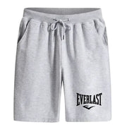 Men's gray knee-length boxing training shorts with Everlast logo and drawstring waist