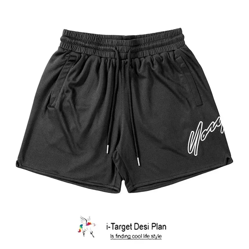 Black mesh men's shorts with elastic waist, drawstring, side pockets, and white script logo on the left leg.