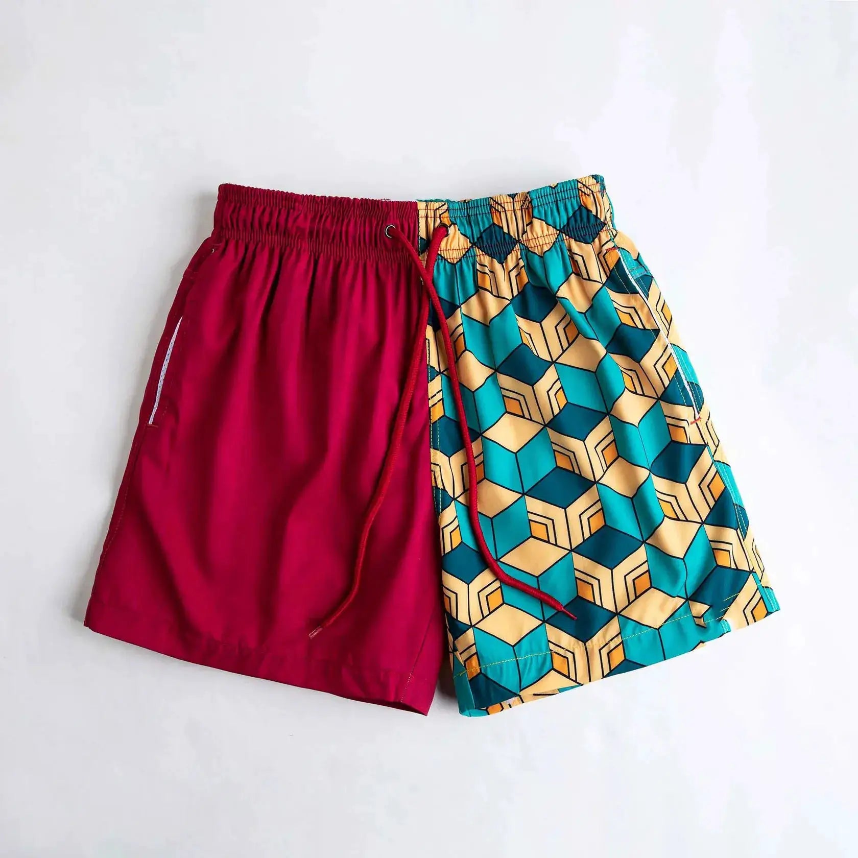 IPPO shorts: two pairs, solid magenta and teal-yellow geometric quick-dry gym/beach shorts.