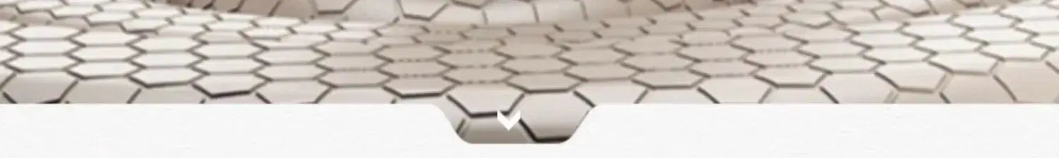 Close-up of a honeycomb hexagonal tile pattern in neutral beige-gray tones.