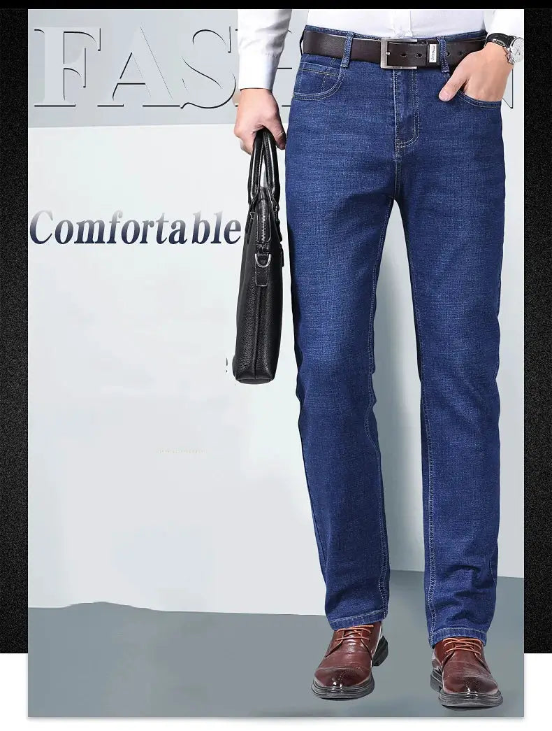 Men's blue stretch straight denim jeans with brown belt and dress shoes