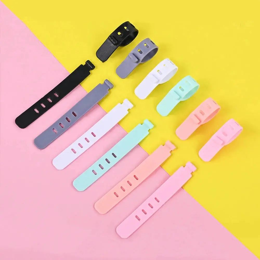 Silicone cable ties by Simples Market in pastel colors for reusable cord organization