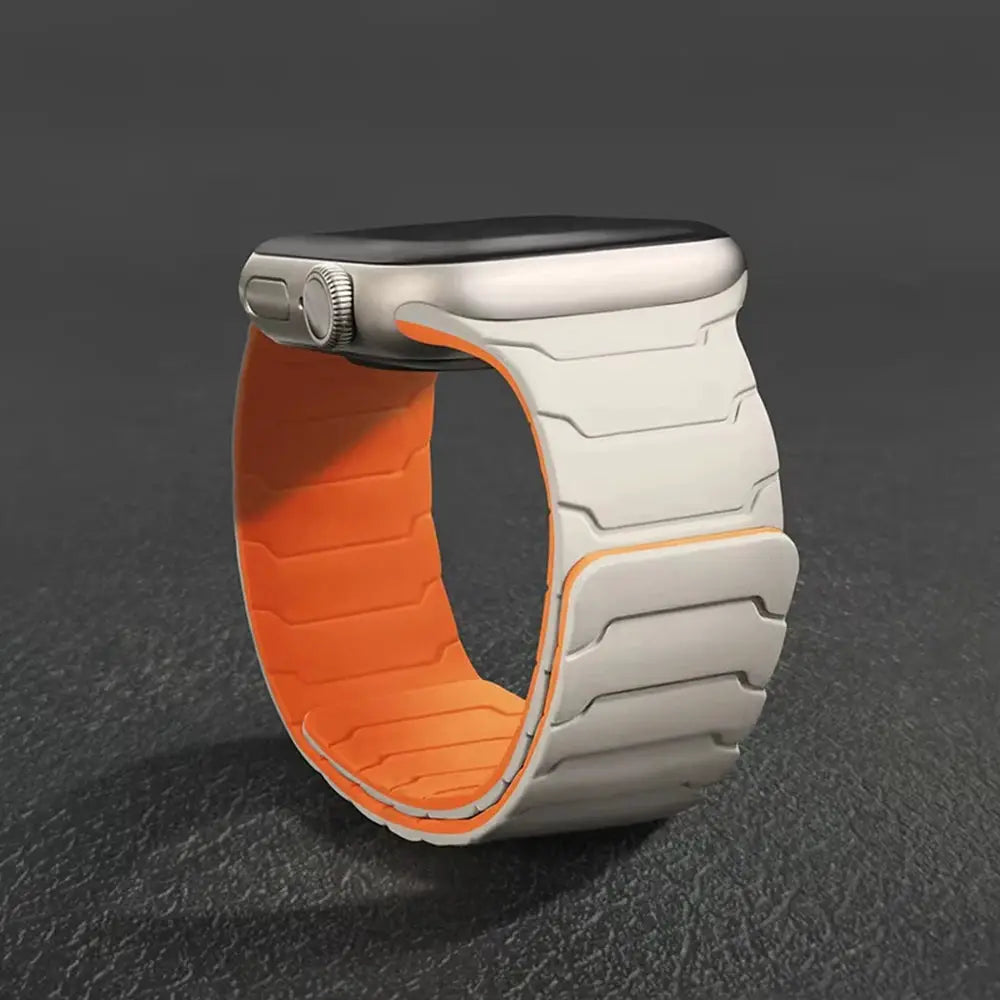 Silicone magnetic Apple Watch band by Simples Market, white exterior with orange interior, fits 40–49mm sizes.