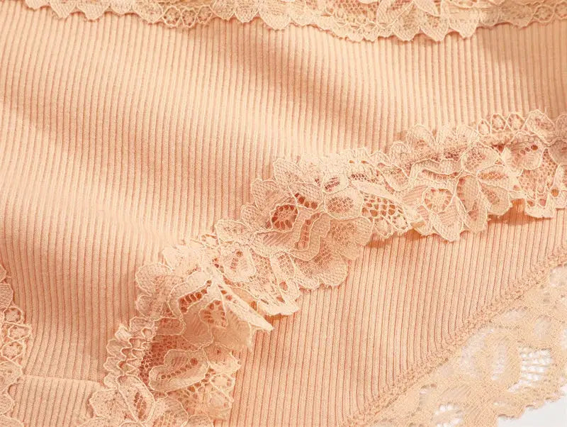 Peach lace-trim cotton panties close-up fabric detail