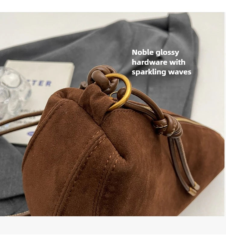 Brown faux suede shoulder bag for women with wooden ring hardware, compact crossbody design
