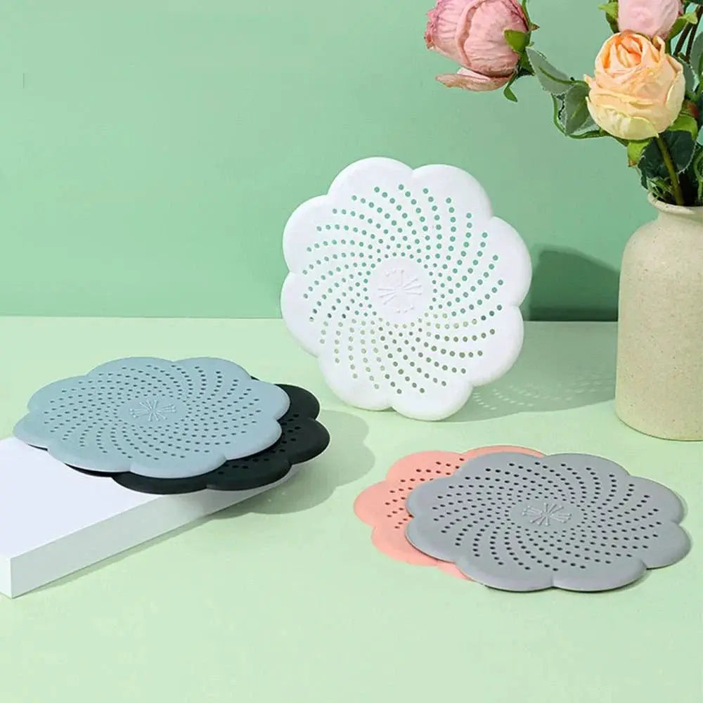 Silicone flower-shaped drain covers, set of six in assorted colors; anti-blocking sink waste strainers.