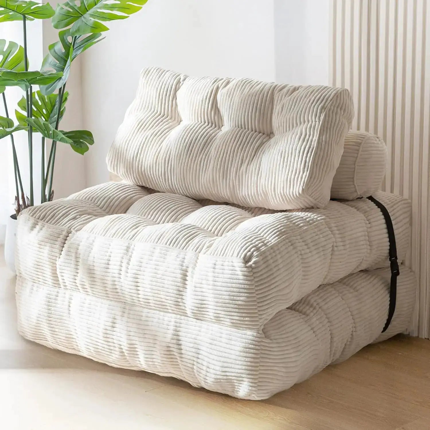 Folding sofa bed by Simples Market in cream corduroy with tufted cushions