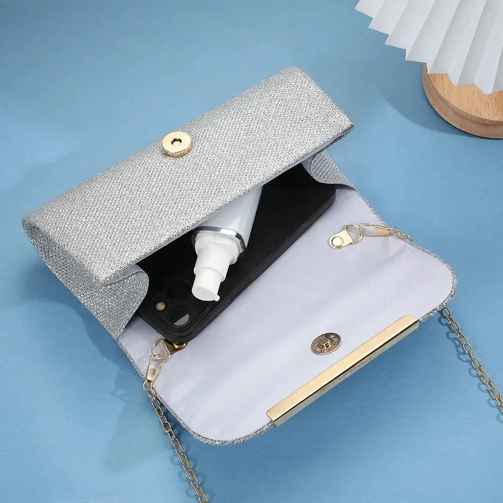 Simples Market sequined evening clutch bag with gold chain strap; silver glitter exterior