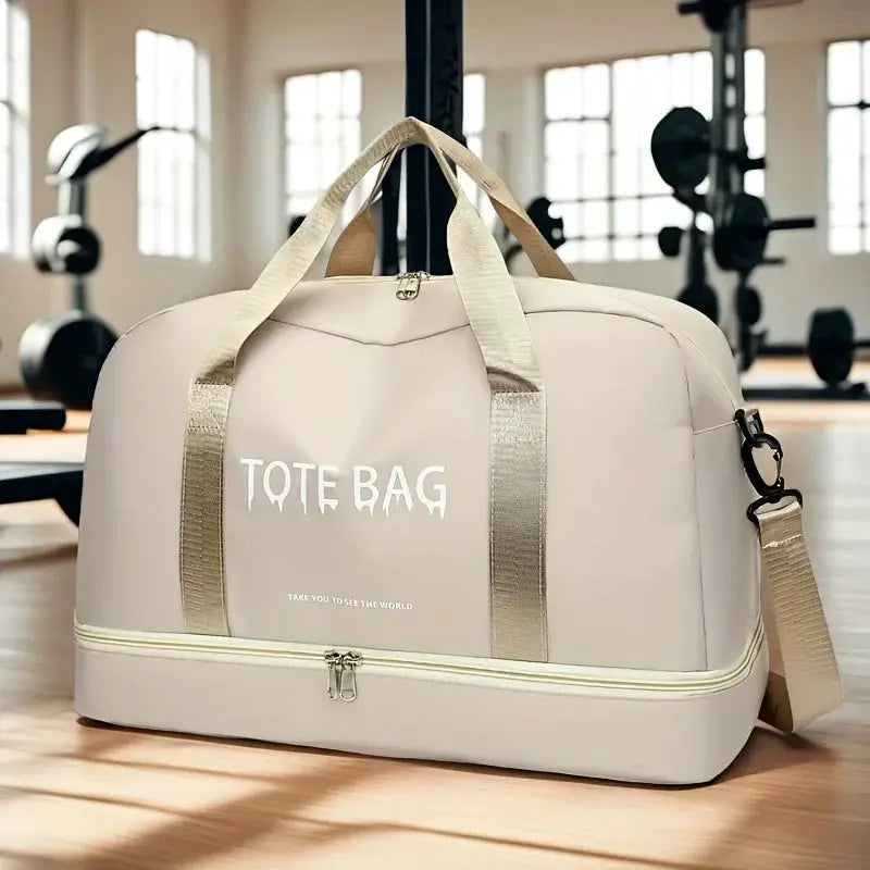 Duffle bag, beige nylon travel bag with top handles and adjustable shoulder strap for gym use