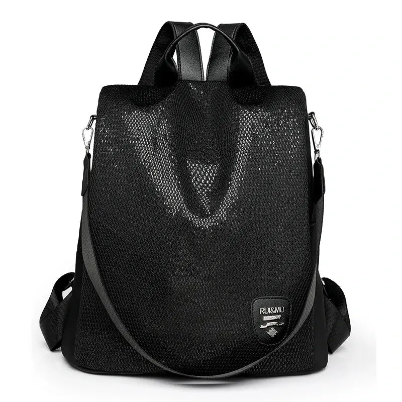 Women's anti-theft backpack by Simples Market, black mesh with adjustable shoulder strap and large capacity.