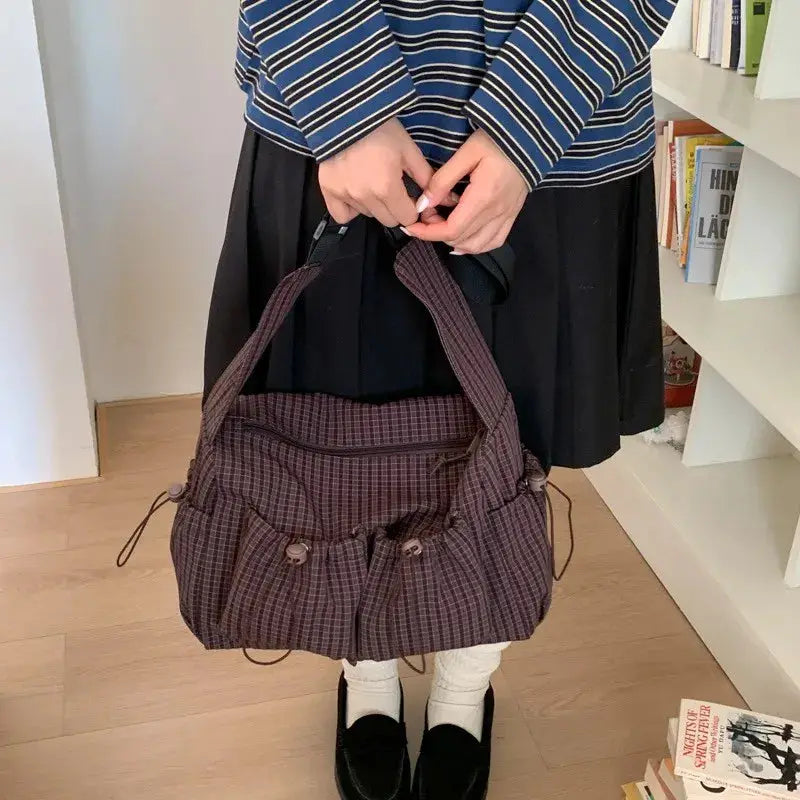 Korean nylon shoulder bag in brown plaid by Simples Market with drawstring pockets