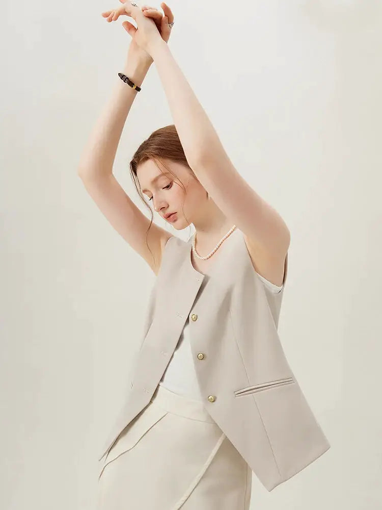 Simples Market FSLE beige sleeveless blazer vest with gold buttons, part of an office suit set with a matching skirt.