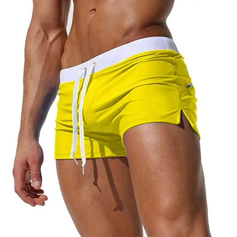 Men's yellow swim trunks with white waistband and drawstring, back pocket detail, quick-drying fabric