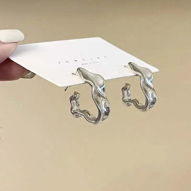Simples Market pair of irregular silver retro minimalist earrings with organic hoop shapes for women