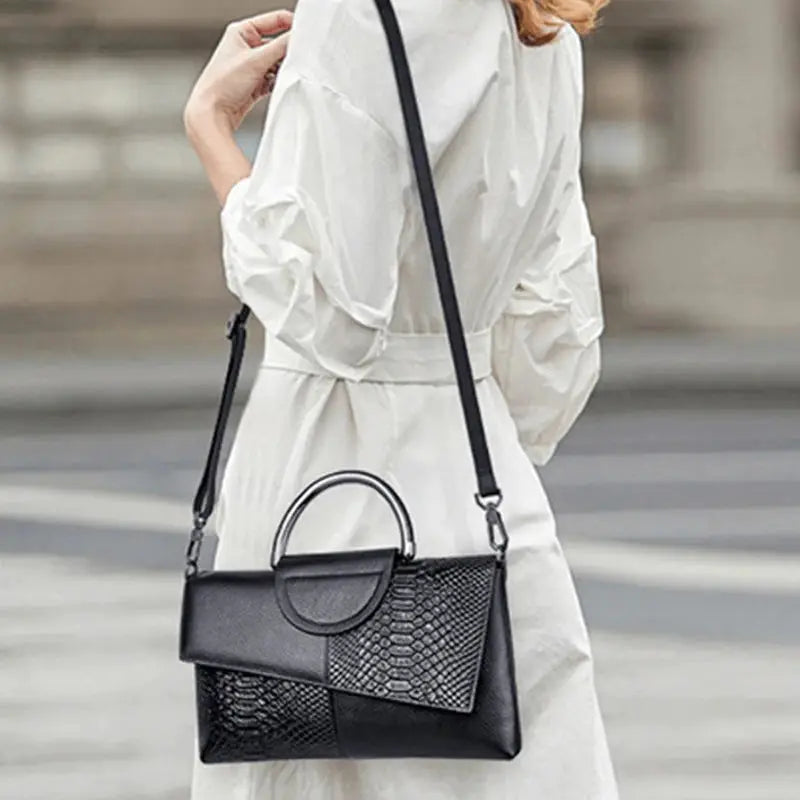 Crossbody bag, black PU synthetic leather with alligator-pattern flap and round ring detail