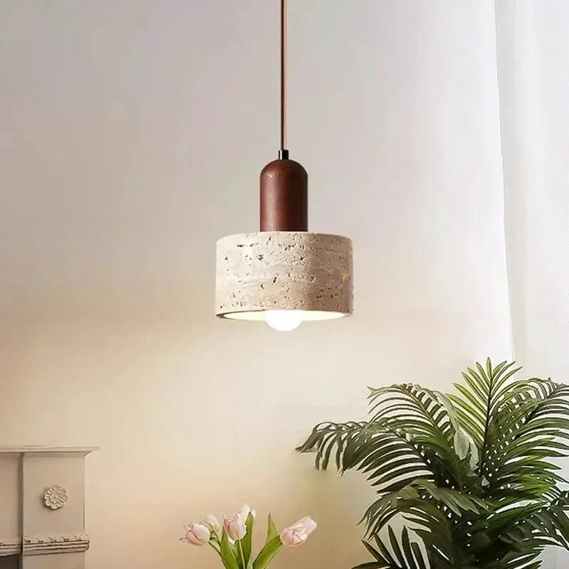 Travertine droplight pendant lamp with brown top over dining island, warm glow