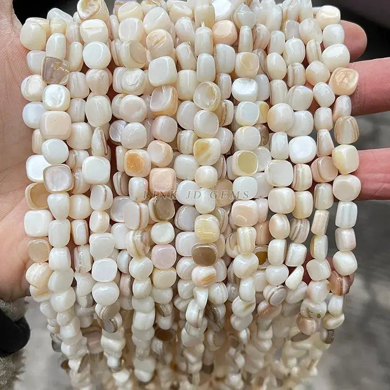 Natural shell beads, irregular smooth ivory-cream shapes, loose spacers for jewelry making