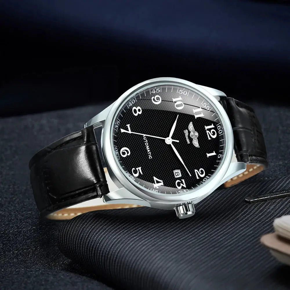 Winner men's fashion business watch with black dial, silver case, automatic movement, and black leather strap.