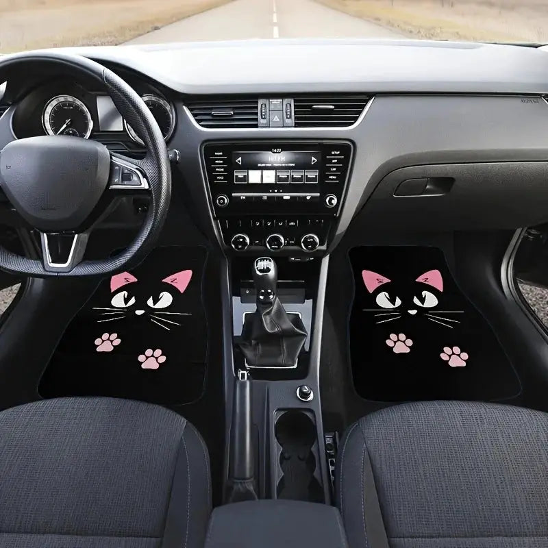Two front car floor mats by Simples Market, black with pink cat faces and paw prints