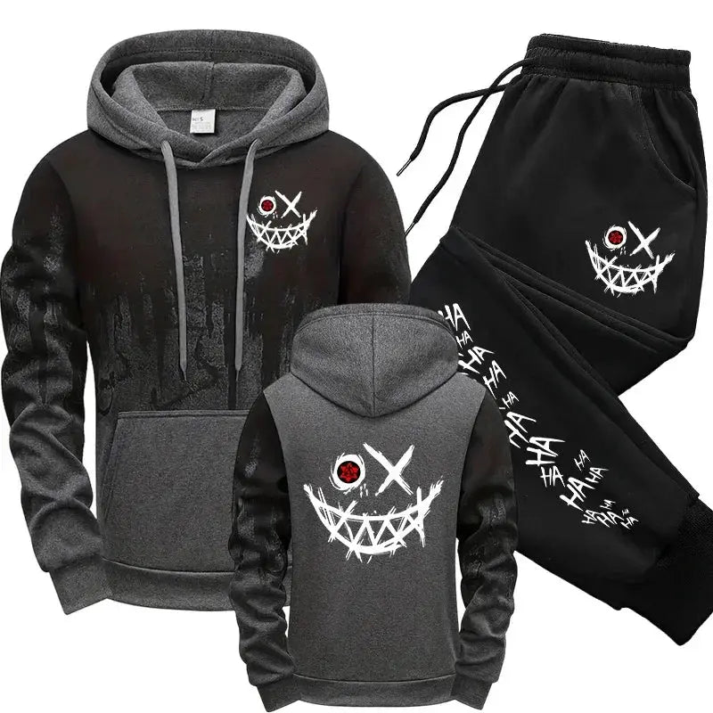 Two-piece men's tracksuit hoodie and pants in black and gray with white splashed ink graphic and red eye emblem.