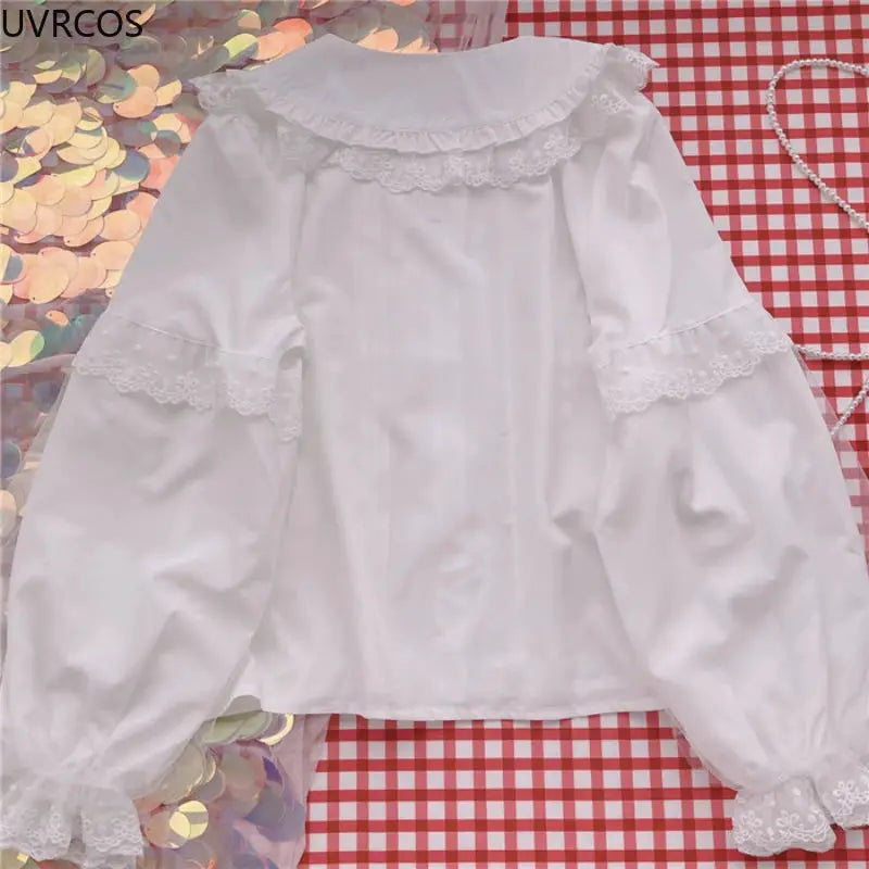 Lolita shirt white blouse with Peter Pan collar, lace ruffle trim, and long puff sleeves