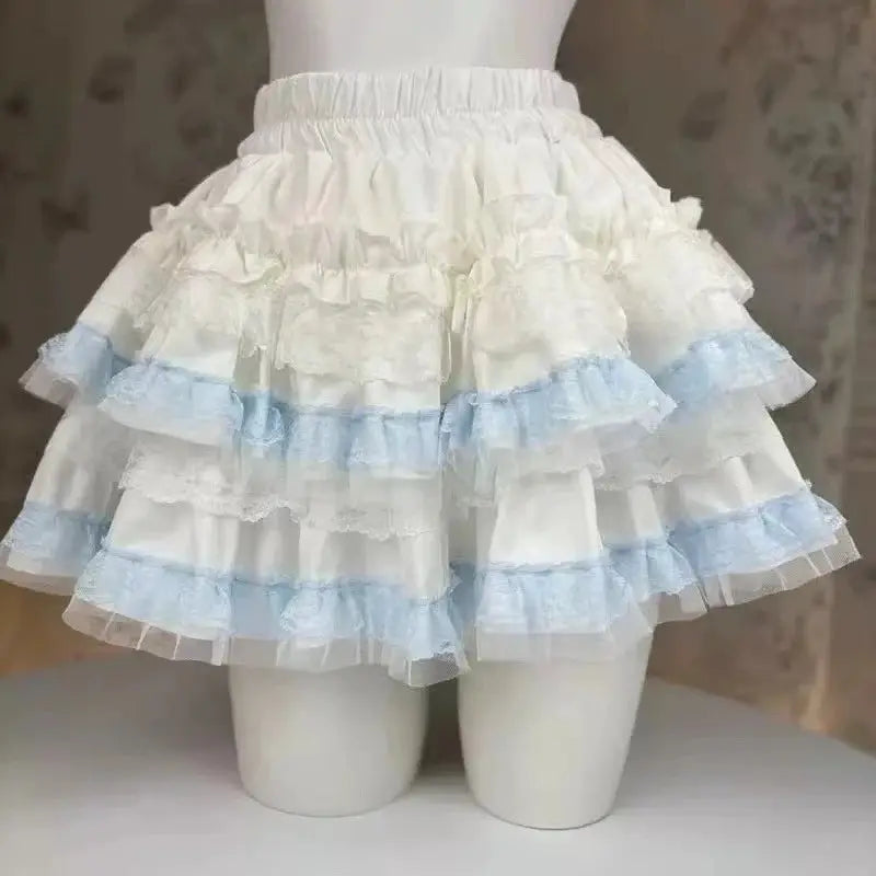 Lolita style cake skirt by Simples Market, layered white lace with light blue ruffles, elastic waist.