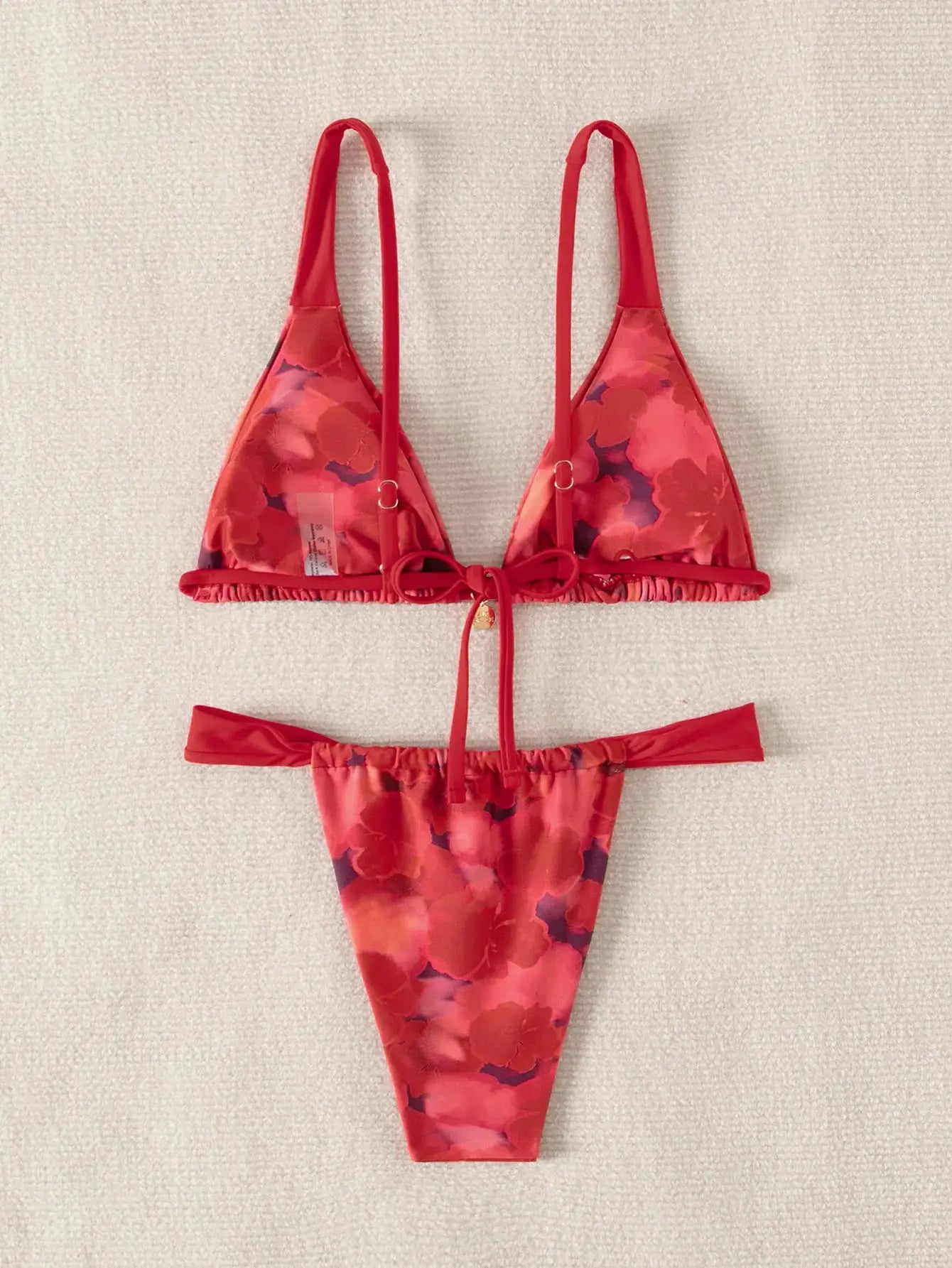 Simples Market two-piece triangle bikini set, red floral print push-up top with tie closures and Brazilian bottoms.
