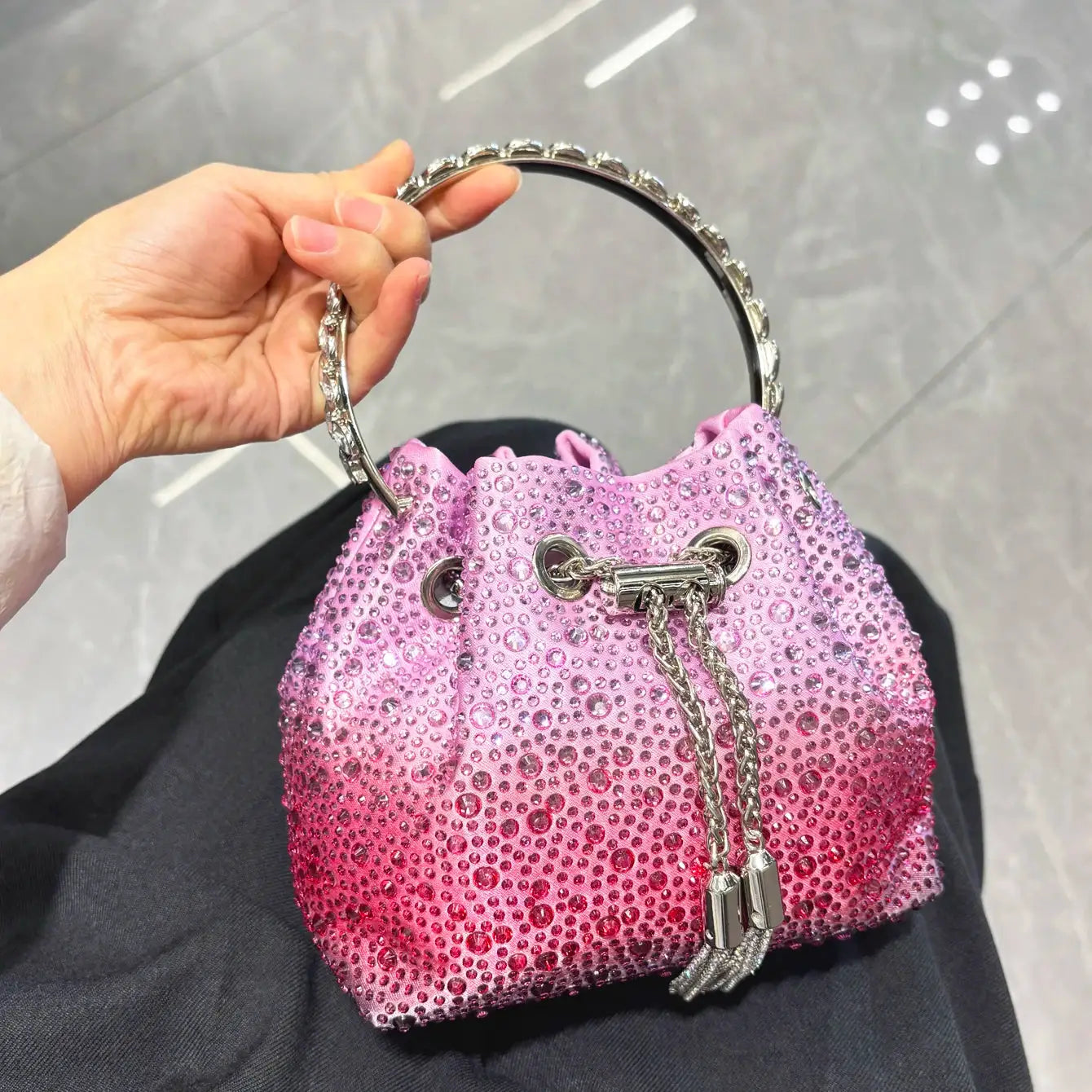 Rhinestone evening bucket bag in pink with crystal-embellished silver handle