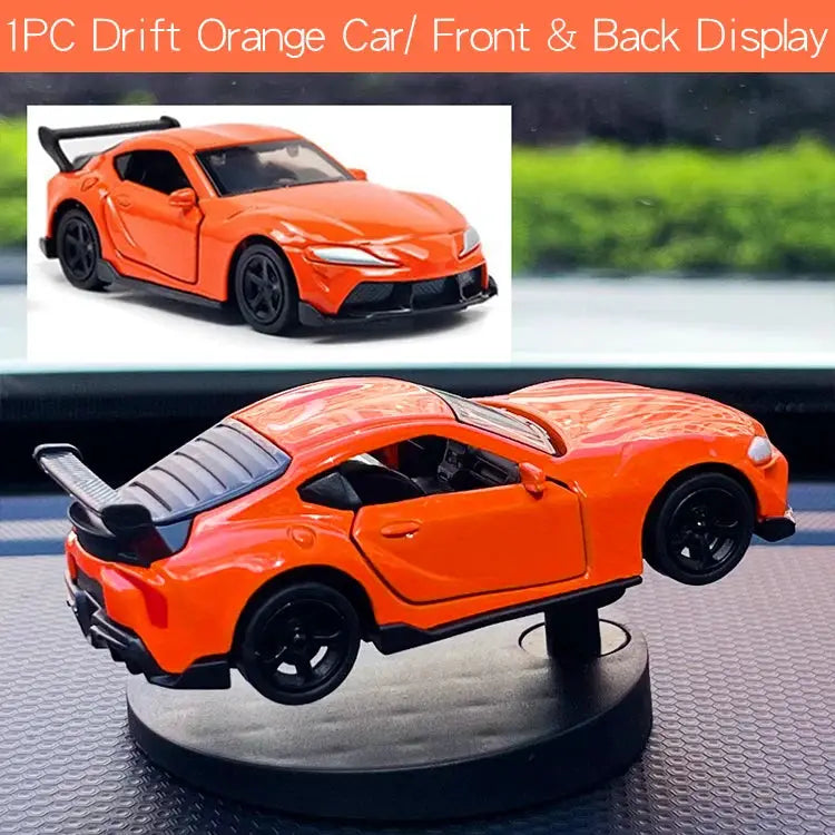 Orange drift car toy model on display base with black wheels and spoiler
