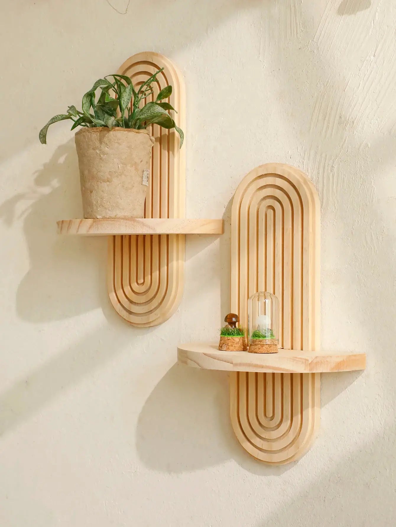 Boho wooden wall shelves by Simples Market; natural finish with two geometric arch panels and plant display.