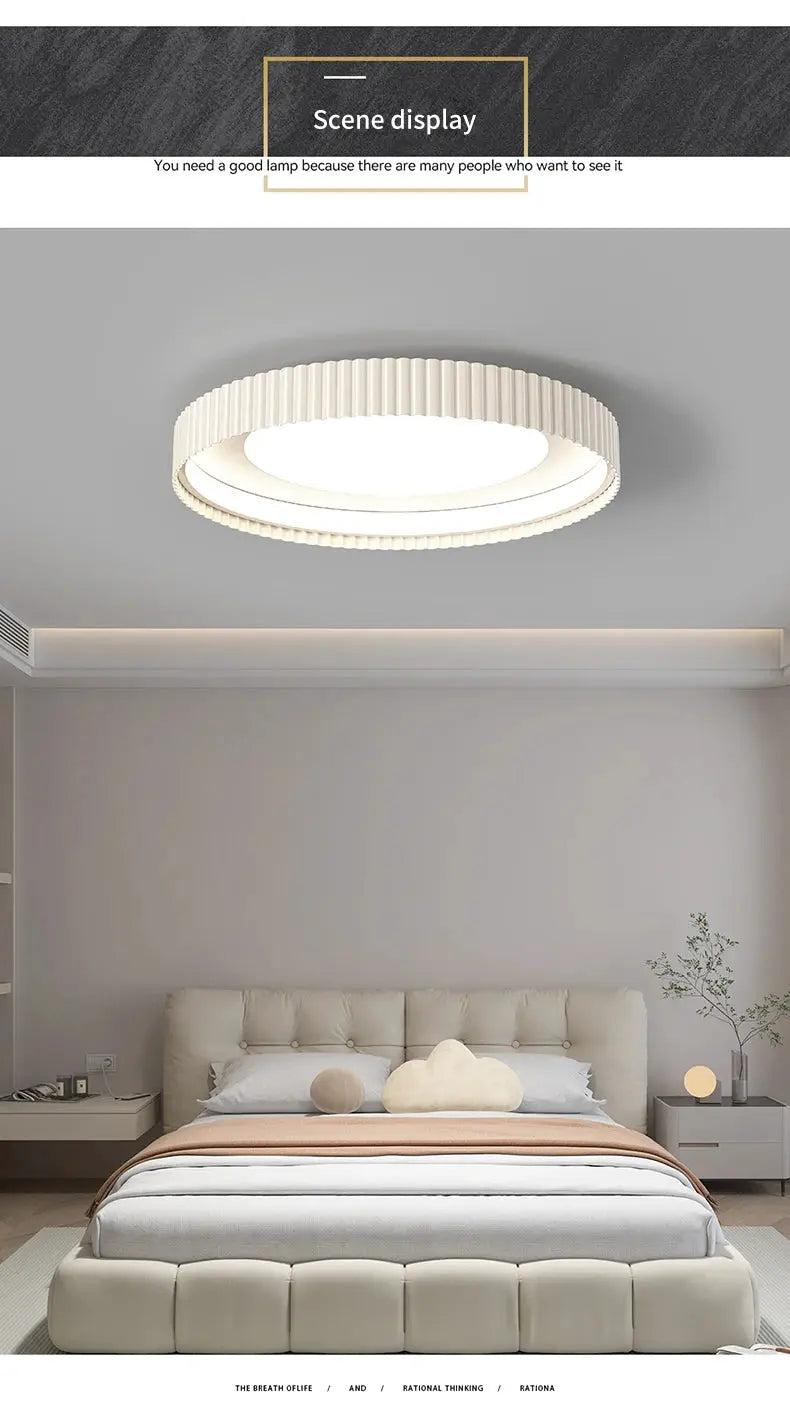 Modern round LED ceiling light with ribbed white metal frame, ideal for master bedroom.