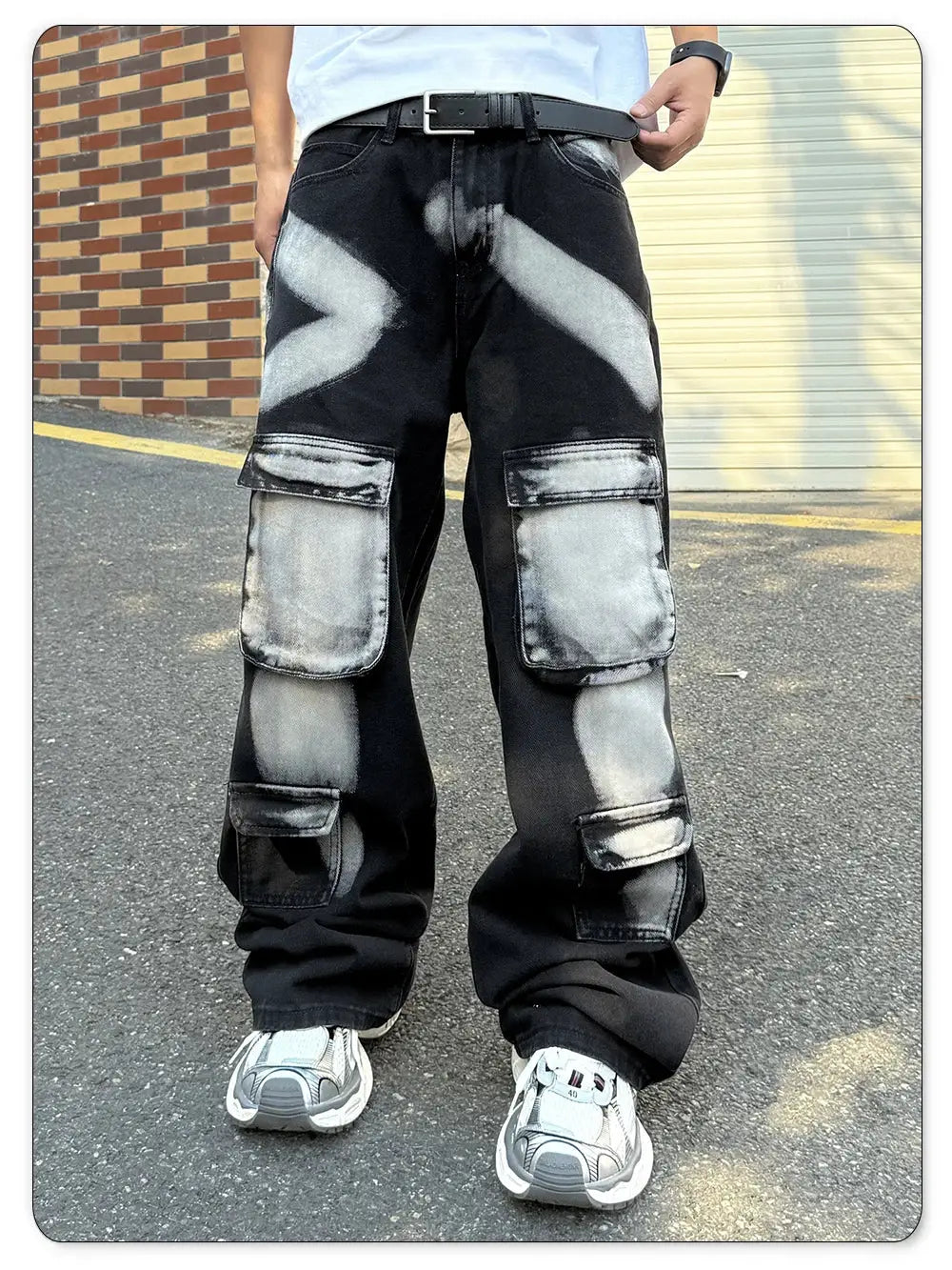 Men's black straight-leg workwear jeans with multiple cargo pockets and splashed-ink pattern.