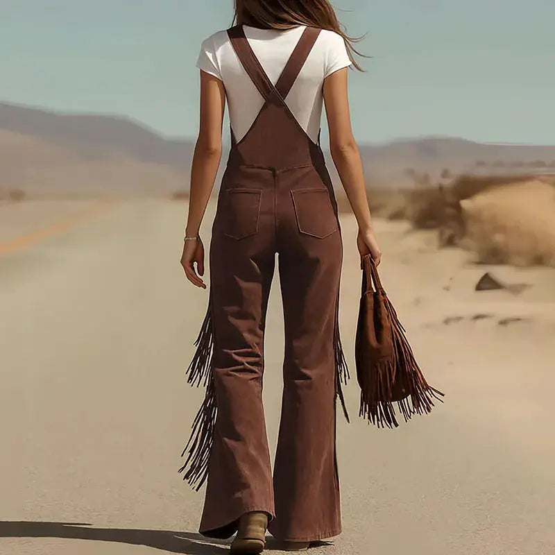 Brown suede wide-leg overalls with cross-back straps and fringe tassels