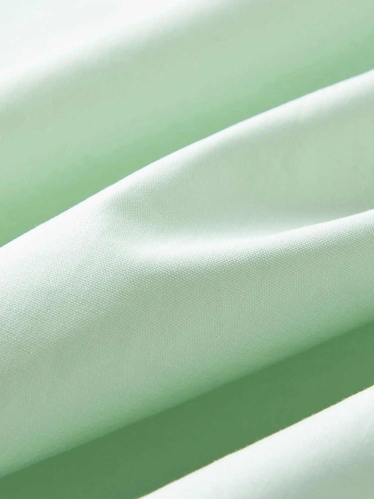 Cotton shirt fabric close-up in mint green by Simples Market