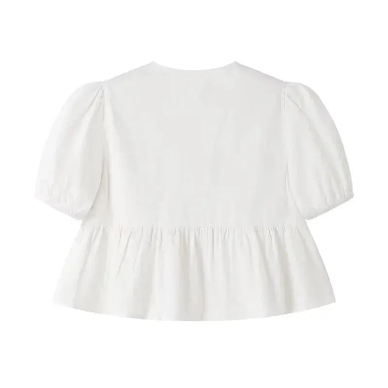 White puff-sleeve blouse with gathered peplum ruffle by Simples Market