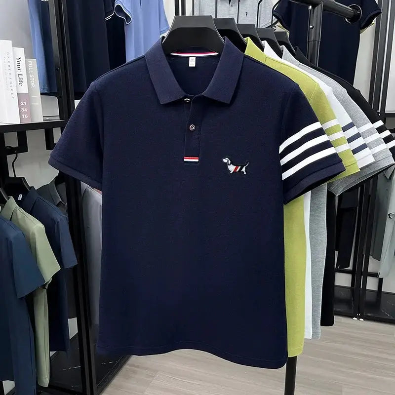 Men's navy polo shirt by Simples Market with short sleeves, cuff stripes, and small dog embroidery
