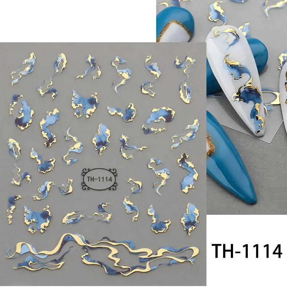 Nail art decals sheet with blue and gold bronzing striped geometric shapes and wavy lines