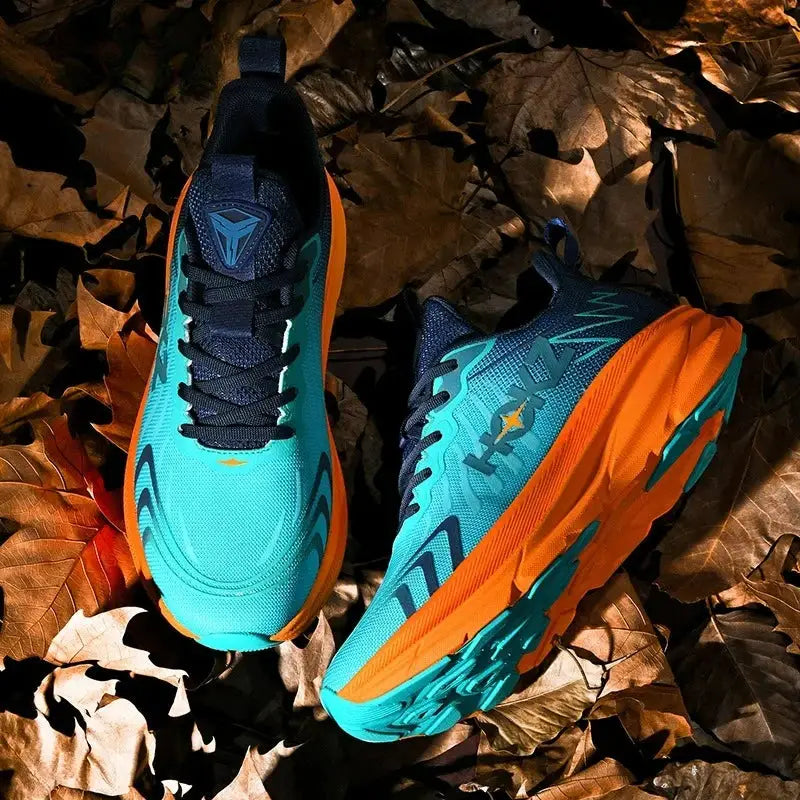 Men's running shoes with teal breathable mesh and orange outsole