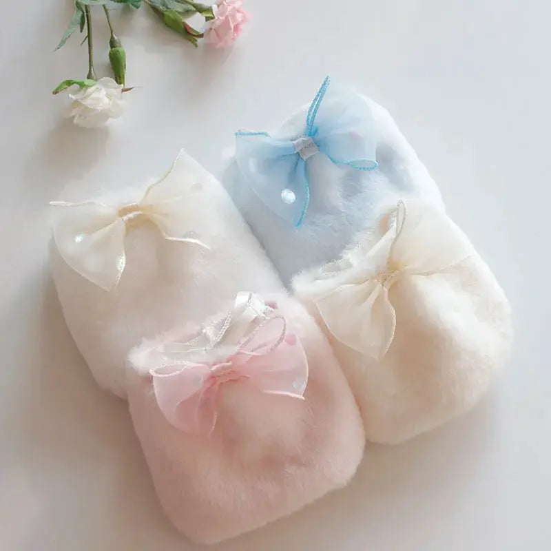 Women's plush bow panties by Simples Market, three candy-colored fuzzy pairs in pink, cream, and blue