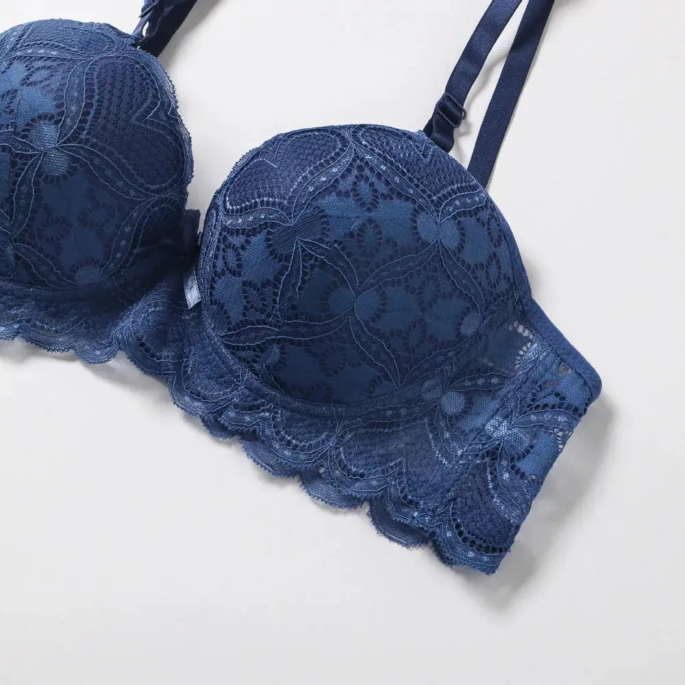 Blue lace push-up bra with scalloped edge, padded plunge design, women's lingerie.