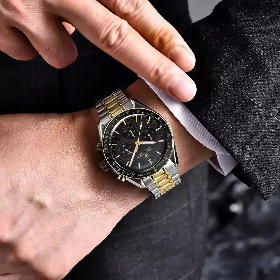Pagani Design PD1701 two-tone gold and silver chronograph watch on wrist with black dial and tachymeter bezel.