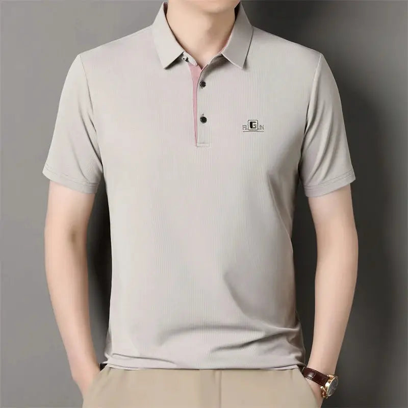 Men's short-sleeve polo shirt, light gray with chest badge.